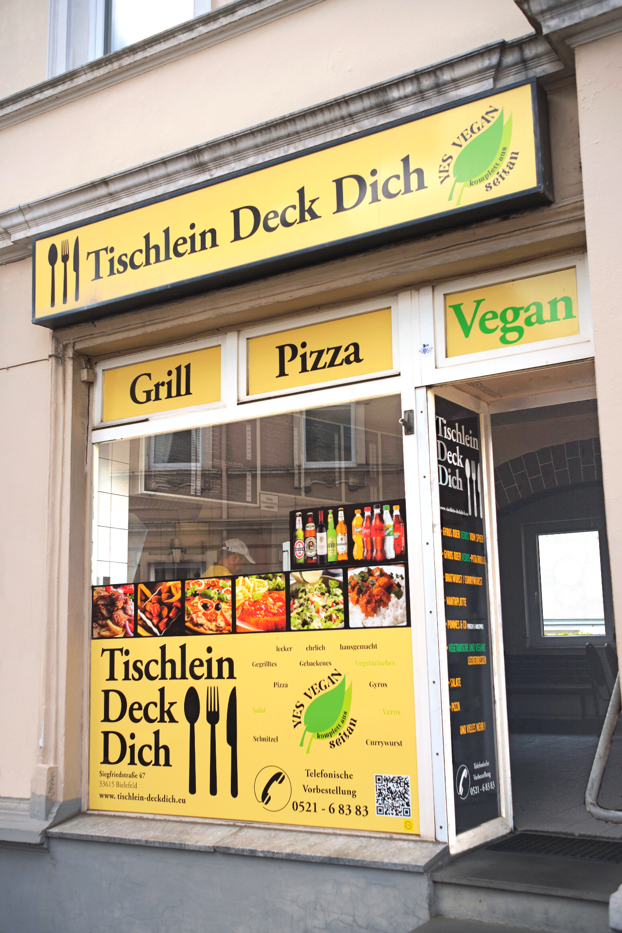 Tischlein Deck Dich Bielefeld — Schaufenster und Schild